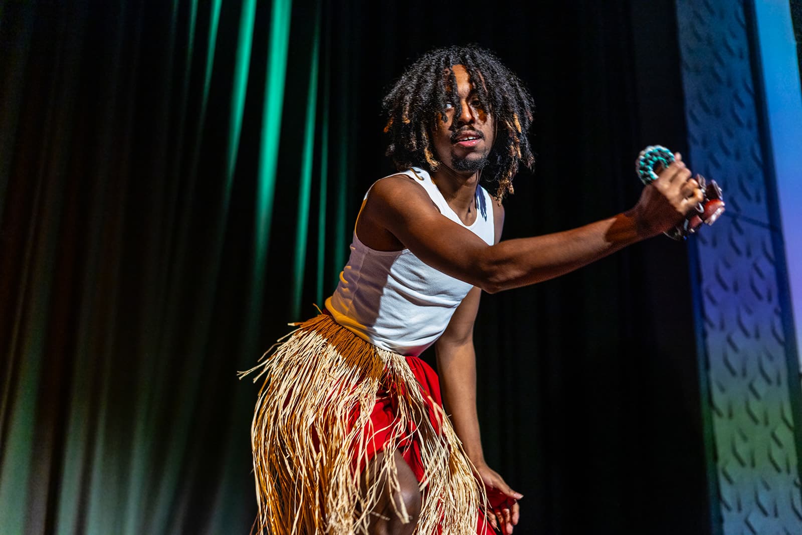 A dancer mid-movement during the cultural performance