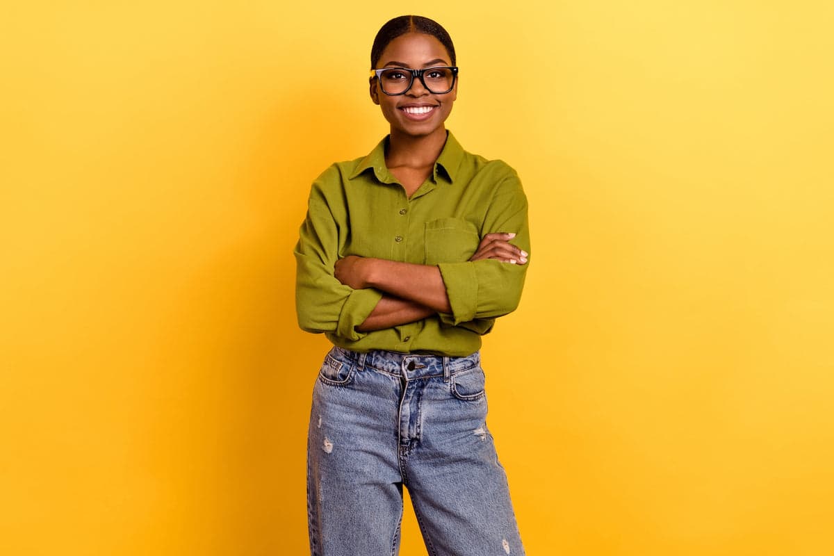 Headshot on a yellow studio backdrop