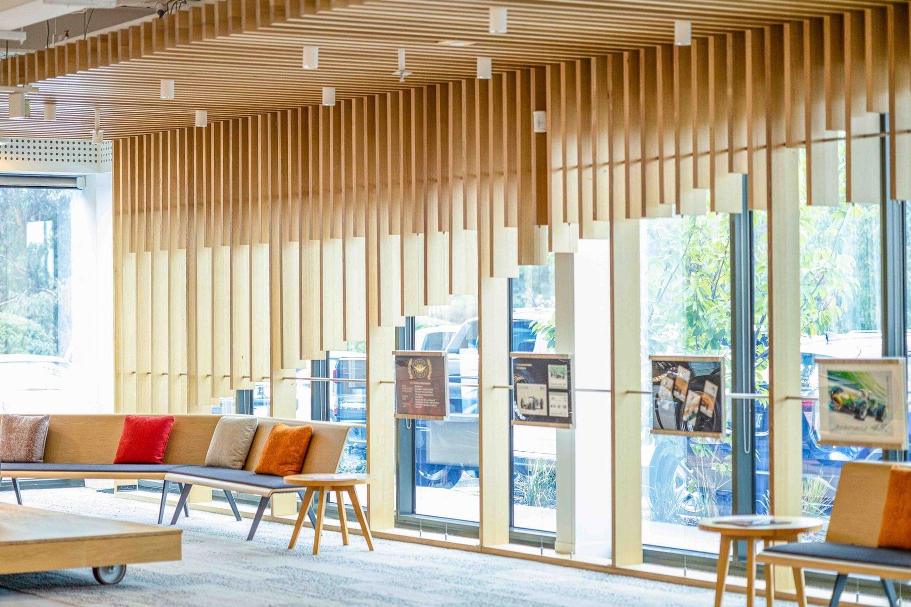 Light-filled interior with timber battens and lounge seating