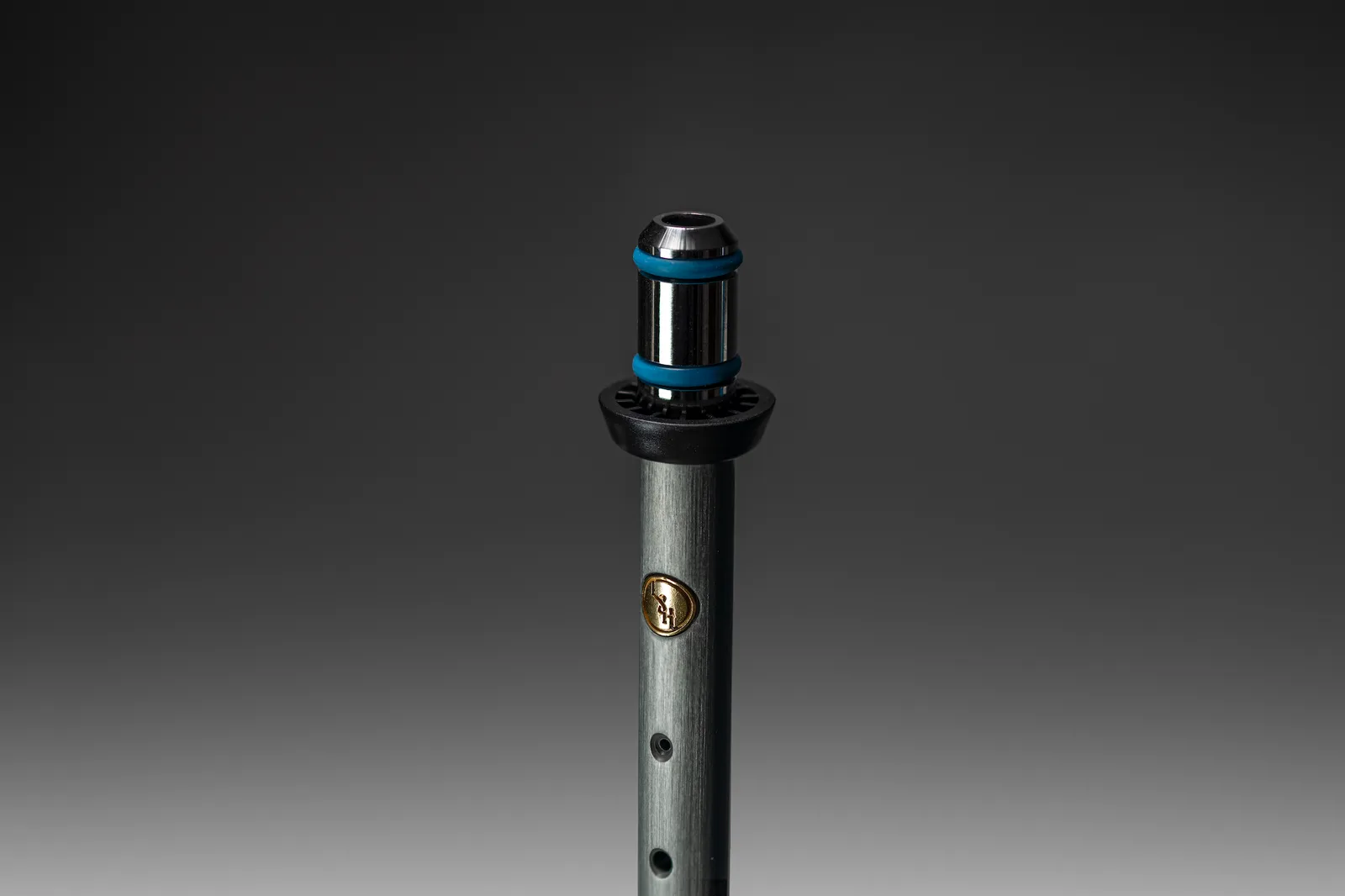 Instrument standing upright under a soft spotlight